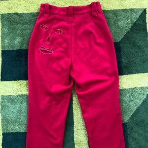 Face Cut Out Red Trousers by the Fashion Brand Company